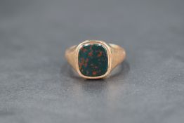 A gent's 9ct rose gold signet ring having bloodstone panel, size O & approx 6.4g