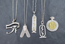 Four Egyptian silver pendants with chains, including hieroglyphics, eye of Horus, etc, approx 27.