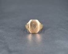 A 9ct gold signet ring, the rectangular panel having the remains of a very worn monogram, ring