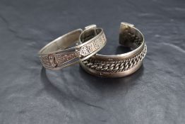 Two Egyptian silver torque bangles, both bearing Egyptian hallmarks, approx 123g total
