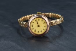 A 9ct rose gold Rolex wristwatch, the white dial having Arabic numerals and the front cover window