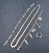 A string of graduated cultured pearls having a silver clasp, a white metal bracelet having six