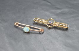 A sapphire and seed pearl bar brooch of openwork design, the three round cut sapphires alternating