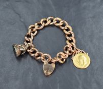 A rose gold charm bracelet having embossed and polished links stamped 9C, a padlock clasp and two