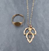 An Edwardian yellow metal pendant stamped 9ct having garnet decoration on a yellow metal chain