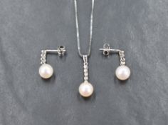 A 9ct white gold cultured pearl and diamond set, comprising a necklace and drop earrings, all having