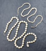 Two strings of cultured pearls comprising a graduated string having a pinkish-white lustre with a