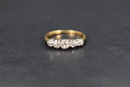A five stone graduated old cut diamond ring, total approximately 0.43ct in a white metal claw set