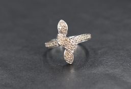 A diamond vertical twist ring, the pave set diamonds in a central vertical twist design with diamond