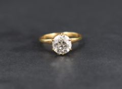 A diamond solitaire ring, the old cut diamond being approx 1.93ct in a 6 claw moulded mount on a