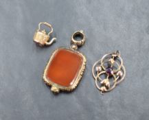 A yellow metal pendant stamped 9ct having amethyst and split floral decoration, sold along with a