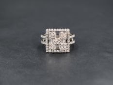 An 18ct white gold square diamond cluster ring, the centre square comprising twenty round