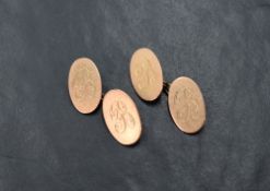 A pair of 9ct rose gold cufflinks, the oval panels each engraved with 'B' initial and having a chain