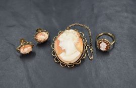 A small cameo ring having circular panel in decorative mount on a yellow metal loop stamped 9ct,