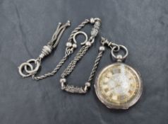 A silver open face pocket watch, the ornate silver dial having Roman numerals and decorative
