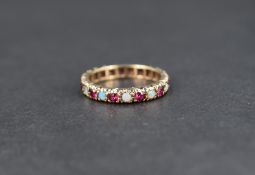 An opal and ruby set full eternity ring in 9ct gold, size L & approx 2.5g
