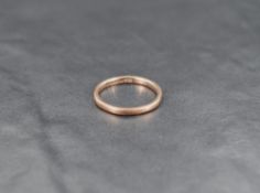 A thin 9ct rose gold wedding band, ring size M-N, 1.7g