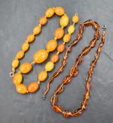 A graduated butterscotch amber bead necklace of twenty-three oval beads, approximately 51cm and 47g,