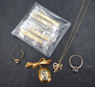 A small selection of yellow metal, some stamped 375/9ct including cherub pendant and chain, brooch