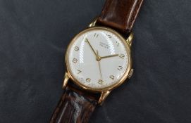 A 9ct gold cased automatic Vertex Revue wristwatch, the champagne dial with Arabic numerals,