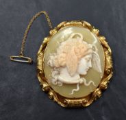 An excellent shell cameo brooch depicting the profile of Medusa adorned with serpents and wings,