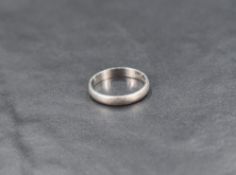 A platinum wedding band of plain form, size J & approx 3g