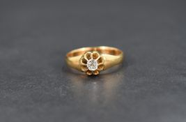 A diamond solitaire gypsy style ring, the mixed cut diamond measuring approximately 0.20cts, on a