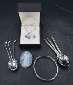 An assortment of silver jewellery including a large cross pendant on a chain, a matching braided