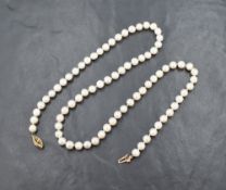 A string of cultured pearls of even form having yellow metal clasp stamped 10K, approx 18'
