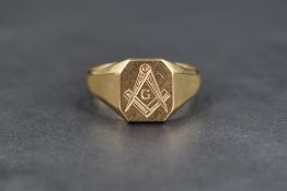 A 9ct gold signet ring, the rectangular panel engraved with the symbol of the Freemasons, the