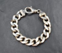 A gent's silver flat curb bracelet having large lobster clasp, approx 220mm long & 77g