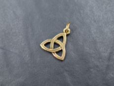 A 9ct gold Fuday charm in the form of a Celtic triscal, the Scottish symbol of the three elements of