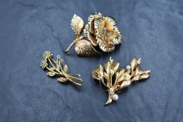 Two vintage 1960s yellow metal Grosse brooches, one of a rose design with faux turquoise, the