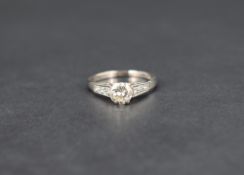A diamond solitaire ring, the brilliant cut diamond being approx 0.54ct in a 6 claw raised mount