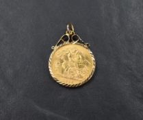 A 1915 George V gold half sovereign pendant with St. George and The Dragon to reverse, set in a 9ct