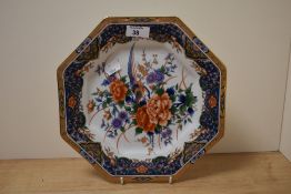 A mid-20th Century Japanese porcelain plate of octagonal form, decorated in polychrome with peonies,
