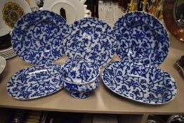 Six pieces of opaque granite 'improved stone' china decorated with flow blue swirls comprising of