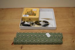An assortment of costume jewellery including cufflinks, beaded necklaces and brooches including an