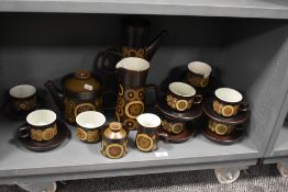 A quantity of Denby Arabesque patterned tableware, to include tea and coffee pots, water jug,