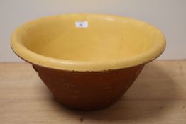 A 19th Century earthenware mixing bowl, measuring 18cm high