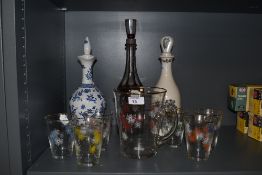 A mid-20th Century hand painted glass lemonade set, and three decanters, to include a Bohemian style
