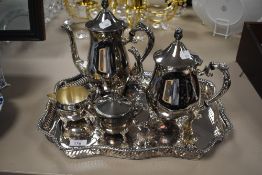 A silver plated four piece coffee set with gallery tray.