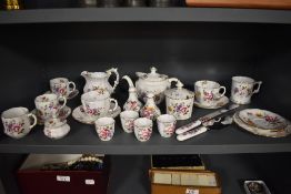 An assorted collection of Royal Crown Derby porcelain teaware and trinkets in the 'Derby Posies' and