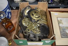 A large collection of horse brasses some having leather straps.