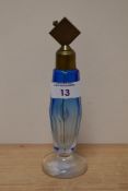 An early 20th Century tinted blue glass scent bottle, of Art Deco design, measuring 18cm high