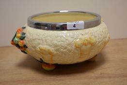 A 1930s footed centre bowl by Clarice Cliff, in the Celtic Harvest pattern, with white metal rim and