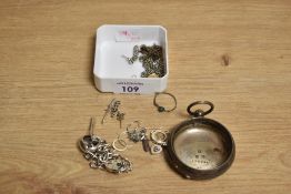 An assortment of silver and yellow metal and white metal jewellery, including a silver curb link