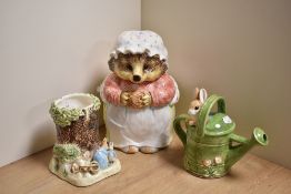 A late 20th Century Enesco Beatrix Potter biscuit barrel modelled as Mrs Tiggywinkle from Peter