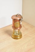 A 20th Century miniature miner's lamp with applied brass plaque for 'Ferndale Coal & Mining Co.',