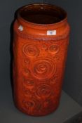 A mid-20th Century West German pottery floor vase, in the Jura pattern against a burnt orange